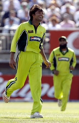 Mohammad Asif celebrates after taking a wicket