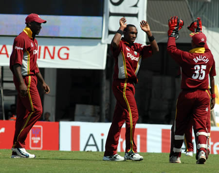 Bravo celebrates after taking a wicket