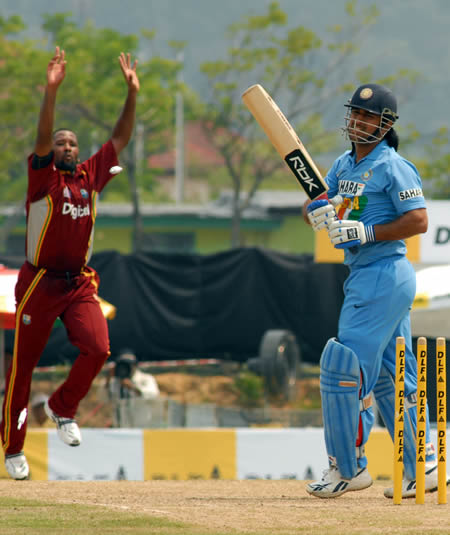 Collymore celebrates as Dhoni walks back to the pavilion