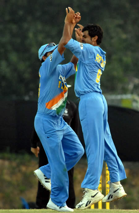 RP Singh celebrates after taking a wicket