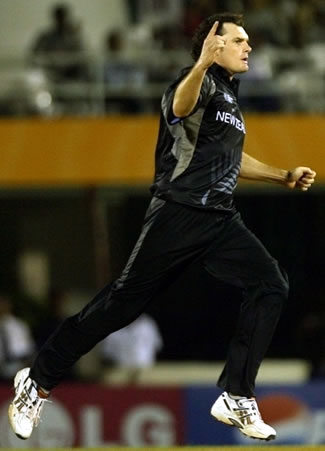 Mills celebrates after taking a wicket