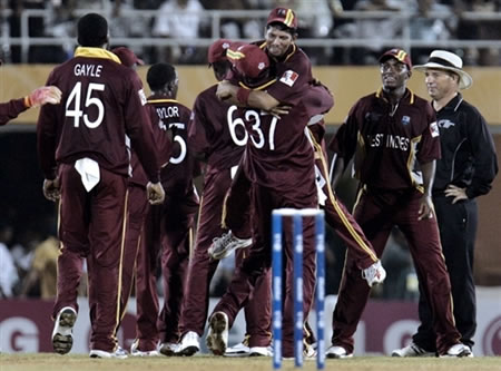 West Indies cricketers celebrate their victory over Australia