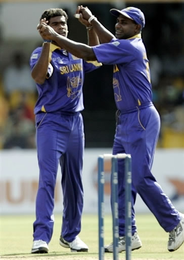 Malinga celebrates with Jayasuriya after taking a wicket