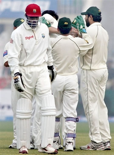 Gayle walks back to the pavilion