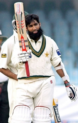 Mohammad Yousuf raises his bat after his century