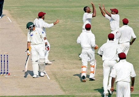 West Indies celebrate the wicket of Shoaib Malik