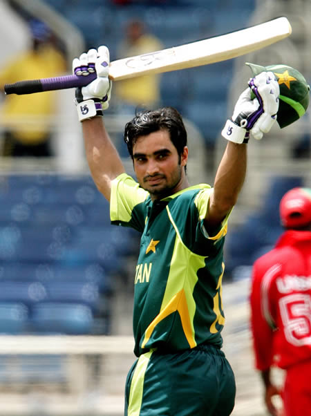 Imran Nazir waves his bat after his century