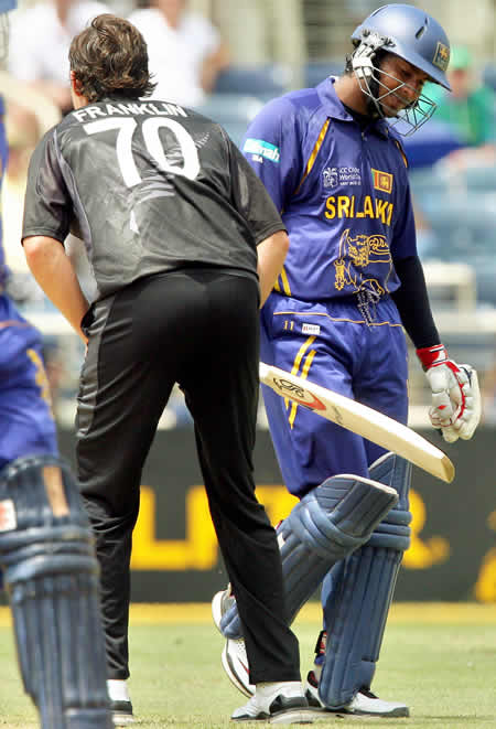 Kumar Sangakkara leaves the field after being dismissed by James Franklin