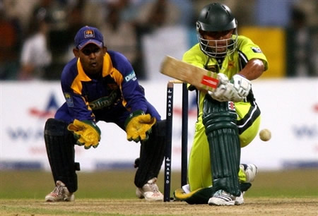 Kamran Akmal plays a sweep shot