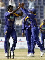 Fernando celebrates the wicket of Imran Nazir