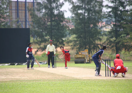 Kaori Iid faces a ball from Nepal bowler Renee Montgomery is non-striker