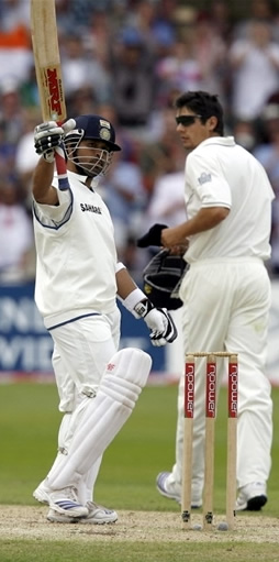 Sachin Tendulkar celebrates after reaching 11,000 Test runs