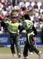 Fawad Alam and Kamran Akmal celebrate the wicket of Vincent