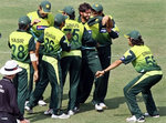Shahid Afridi celebrates the wicket of AB de Villiers with his teammates