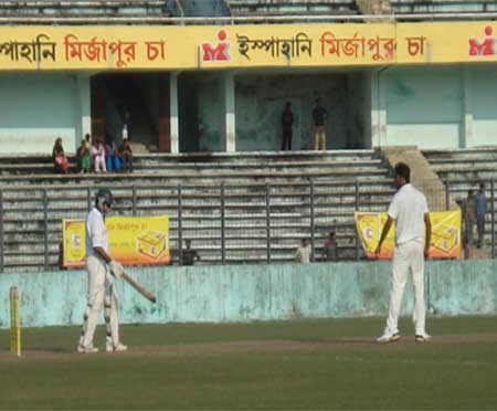 Shahadat Hossain Rajib (R), the Dhaka fast bowler, gives Khulna batsman Tushar Imran a stare