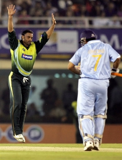 Shoaib Akhtar celebrates the wicket of Dhoni