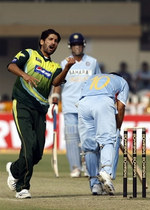 Sohail Tanvir celebrates the wicket of Sachin Tendulkar