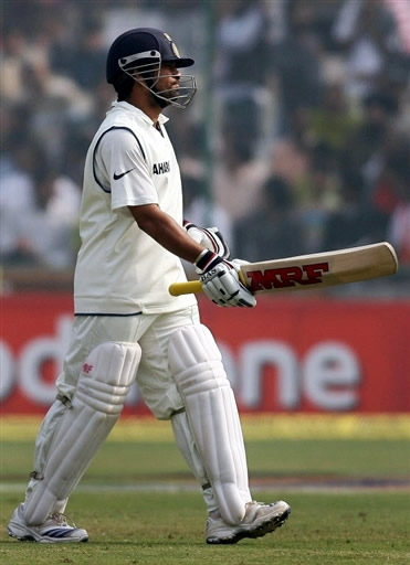 Sachin Tendulkar walks back to the pavilion after getting runout