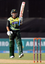 Kamran Akmal celebrates his fifty