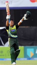 Kamran Akmal celebrates his hundred