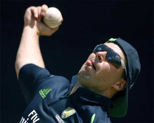 Brad Hodge bowls in the nets at a team training session