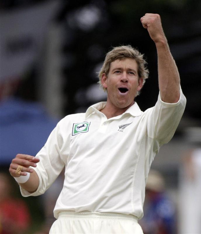 Jacob Oram celebrates getting England's Alastair Cook out