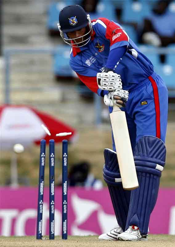 Kevin Hurdle is bowled by India's Ajit Agarkar