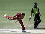 Pedro Collins displays his unusual bowling style