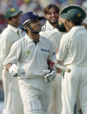 Sachin Tendulkar walks off as he was dismissed for 52