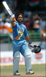 Mahender Dhoni celebrates after scoring a century