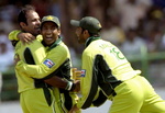 Naved-ul-Hasan, Yousuf Youhana and Kamran Akmal celebrate