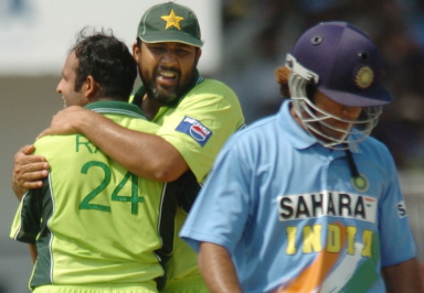 Naved-ul-Hasan is hugged by Inzamam-ul-Haq