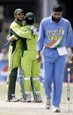 Shahid Afridi is congratulated by Salman Butt