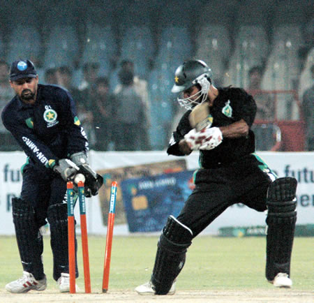 Mohammad Hafeez bowled as Moin Khan looks on