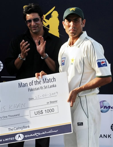 Younis Khan holds man of the match award