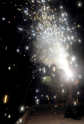 Pakistan fan lights fireworks in Karachi