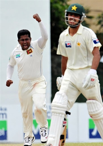 Herath celebrates the wicket of Fawad