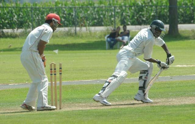 Kenya's Alex Obanda is bowled by Canada's Zameer Zahir