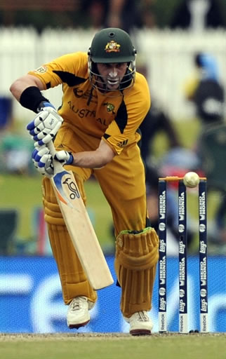 Mike Hussey plays a shot