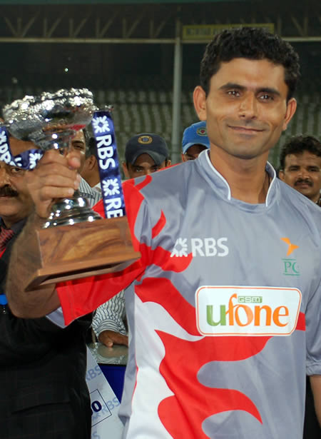 Abdul Razzaq holds Man of the Match Trophy