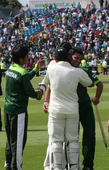 Farhat and Kamran hug each other after historic win over Australia