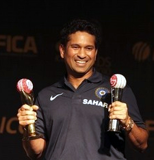 Sachin Tendulkar holds the trophies after he won Cricketer of the Year and People's Choice awards