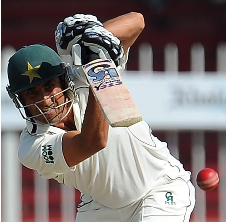 Younis Khan punches the ball down the ground