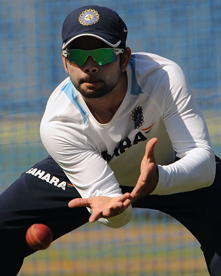 Virat Kohli participates in a fielding drill