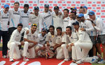 The Indian team and support staff with the trophy