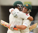 Usman Khawaja and David Warner embrace after hitting the winning runs