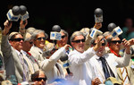 Fans dressed as Richie Benaud cheer at the SCG