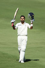 Virat Kohli acknowledges the cheers after his ton