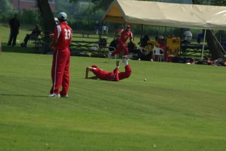 Drive by Razur-ur-Rehman just beats the diving cover fielder