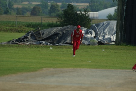 A fielder celebrates after taking an easy catch at long-on